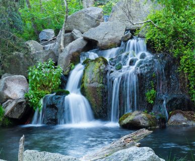 A long exposure shot of waterfall flowing down from rock formations